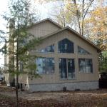 Showing the nearly completed exterior. A deck was added to complete the project.