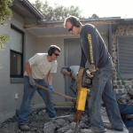 Removing a small porch to allow for an addition foundation to be poured.